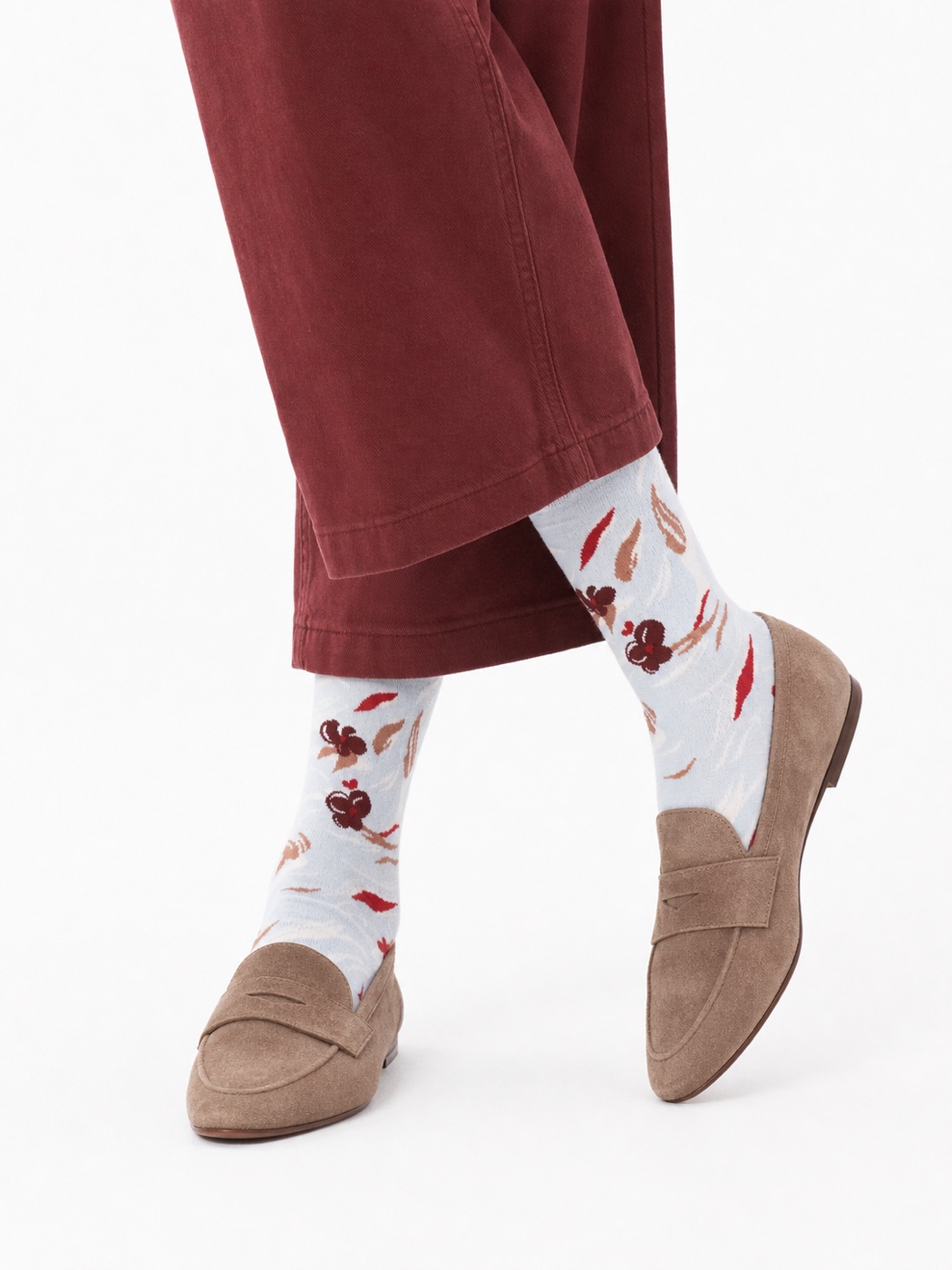 Pale blue Nollaknit socks with burgundy butterfly and leaf motifs
