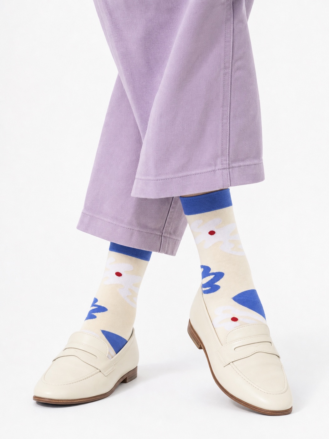 Cream Nollaknit socks with periwinkle flower motifs