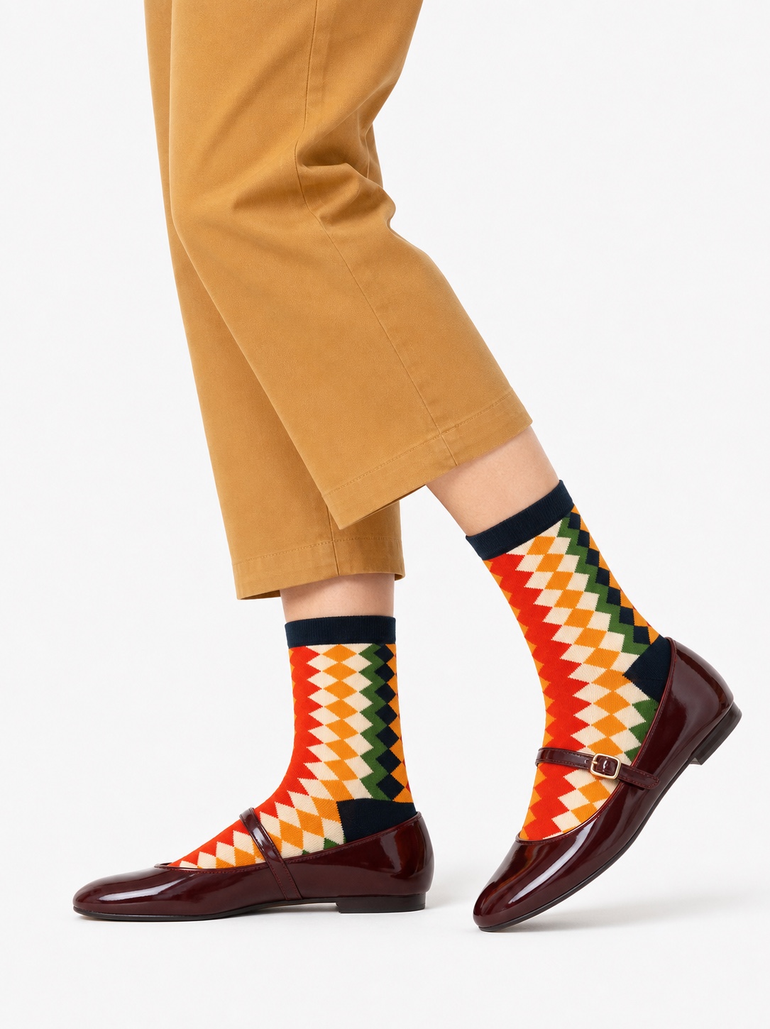 Nollaknit socks with red, orange, cream and green diamonds