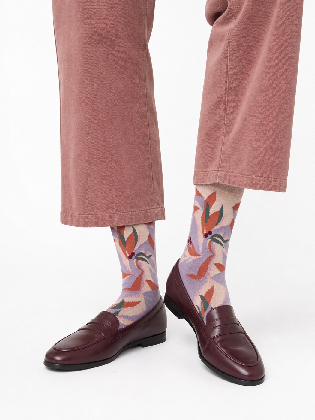 Plum Nollaknit socks with botanical bird motifs
