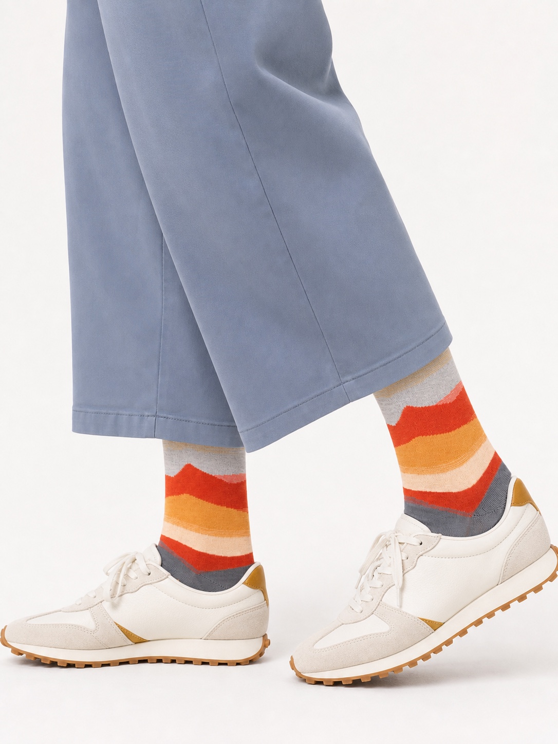Nollaknit socks with orange, cream, grey and ochre horizon stripes